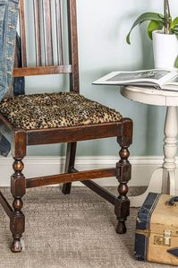 Flea market flip ideas, Vintage yardsale chair with it's original wood finish is updated with a faux fur cheetah fabric seat