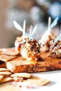 Honey Goat Cheese Balls are a simple, festive appetizer. Soft goat cheese is formed into balls and rolled in a mixture of honey, apricot preserves and pecans. You can easily switch up the nuts and preserves to create different flavor combinations! // acedarspoon.com #goatcheese #appetizer #fingerfood #snack #honey #pecans #goatcheeseballs