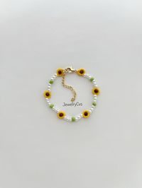 Title: Sunflower Pearl Bracelet, Anklet Bead Jewelry Gift for Her Approximate; bracelet length: 16 cm + 5 cm adjustable chain, anklet length: 22 cm + 5 cm adjustable chain It was made with glass pearl  and glass beads.  Quality materials were used. I recommend that you keep the product away from contact with water, sweat,  perfume and chemicals.