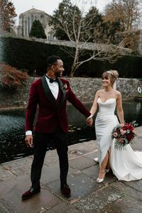 Bride in strapless wedding dress with sparkly Jimmy Choo wedding shoes with the groom in a red velvet suit jacket for their couple portraits | wedding photography | traditional wedding | winter wedding | Nicola Drummond Photography