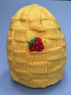 This is a handmade knit hat with a basket weave pattern. The hat is yellow and made to fit a child 3 years and up.  There are three embroidered strawberries spaced evenly around the hat. A strawberry can be seen from every angle. If you are interested in a different color hat or embroidery, please feel free to let me know. I love doing custom orders!  Little ones will stay warm outside all day long Cute Yellow Winter Hat, Yellow Knitted Hat, One Size Fits Most, Yellow Knitted Hat One Size Fits Most, Yellow One-size Yarn Beanie, Yellow Yarn Crochet Beanie Hat, Hand Knitted Yellow Crochet Hat, Yellow Yarn Crochet Cap, Yellow Crochet Cap Hat, Handmade Hat Knitting Pattern