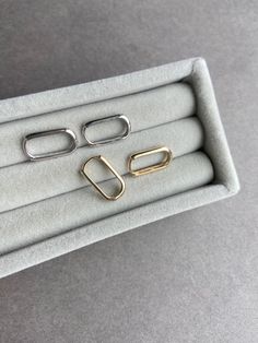 14K Solid Gold  Rectangle Huggie Hoop Earrings - 14K Solid Gold Quantity: One Pair Material : Entirely 14K solid gold Color : Yellow Gold / White Gold Size : 9.3mm*16.5mm  Thickness : 2mm * Metal components are 14K Solid Gold including earring backs. * Suitable for delicate and sensitive ears. * Comes in a jewelry box. If you need extra boxes for gifting....just let us know! Gold Oblong Hoop Earrings For Everyday, Gold Oblong Huggie Earrings For Everyday, Gold Rectangular Huggie Earrings For Everyday, Yellow Gold Oblong Hoop Earrings For Everyday, Rectangular Yellow Gold Hoop Earrings For Everyday, Yellow Gold Everyday Hoop Earrings, Everyday Yellow Gold Oblong Hoop Earrings, Minimalist Yellow Gold Oblong Hoop Earrings, Rectangular Yellow Gold Huggie Earrings Minimalist Style