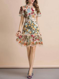 Spring A-line Floral Cocktail Dress, Elegant A-line Mini Dress With Floral Embroidery, Multicolor A-line Dress With Floral Embroidery, Knee-length Floral Print Mini Dress, Summer V-neck Midi Dress With Embroidered Hem, Floral Embroidered Midi Dress For Spring, Floral Embellished A-line Midi Dress, Spring Floral Embroidered Midi Dress, Elegant Spring Embroidered Cocktail Dress