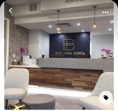 the front desk of a dental office with two chairs