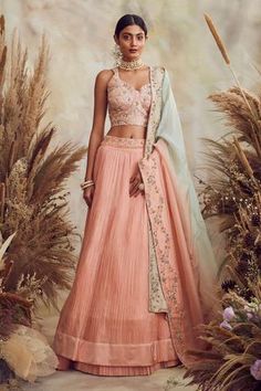 Peach lehenga with all-over pleats. Comes with embroidered blouse, dupatta and belt.
Components:4
Pattern:Embroidery
Type of Work:Cutdana, Sequin and Thread
Neckline:Sweetheart
Sleeve Length:Sleeveless
Fabric:Georgette and Organza
Color:Peach
Other Details:
Cutwork hem
Belt with bead hangings
Dupatta with embroidered border
Occasion:Wedding - Aza Fashions Luxury Peach Dupatta With Traditional Drape, Traditional Luxury Peach Lehenga, Luxury Traditional Peach Lehenga, Luxury Peach Dresses With Traditional Drape, Luxury Peach Dress With Traditional Drape, Luxury Peach Dupatta With Cutdana, Luxury Embroidered Peach Lehenga, Luxury Peach Traditional Wear With Cutdana, Luxury Semi-stitched Peach Lehenga