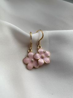 These stunning pink flower earrings are perfect for a friend, yourself or gift for Mother's Day! - Handmade by me  - Hypoallergenic gold plated 304 stainless steel hooks - All earrings come with a rubber back. - Your purchase will come in a card holder, bag, and a bag of sweets 🍬  - For hygiene reasons NO RETURNS OR     REFUNDS. - FREE SHIPPING Care info:  Please take care of your handmade earrings. Do not sleep in them, come into contact with water with them or perfume etc as this will damage Cheap Spring Flower Charm Earrings, Aesthetic Pink Jewelry, Spring Feminine 3d Flowers Jewelry, Feminine Flower Shaped Jewelry For Spring, Feminine Blossom Jewelry For Spring, Feminine Flower-shaped Jewelry For Spring, Rose Gold Flower Shaped Jewelry For Spring, Rose Gold Flower-shaped Jewelry For Spring, Feminine Spring Flower-shaped Jewelry