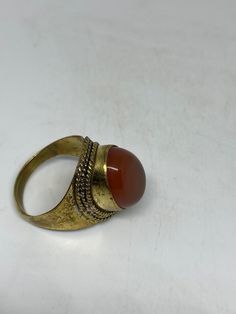 Vintage Genuine Red Carnelian golden Bronze Ring Size 8.5 can be re sized to any size if you request it. There is a $20 jeweler's fee All rings are shipped in a nice gift box. Check out our over a THOUSAND great reviews Engraving is $4 per letter and is not always perfect depending on the piece. It can take a few days if the jeweler is busy. This is payable to Paypal Judithsltd@gmail.com Vintage Oval Cabochon Opal Ring Gift, Vintage Gold Opal Ring Gift, Vintage Gold Opal Ring For Gift, Vintage Carnelian Jewelry With Polished Finish, Classic Carnelian Cabochon Rings, Classic Carnelian Ring Jewelry, Vintage Polished Carnelian Jewelry, Polished Carnelian Ring, Classic Carnelian Ring