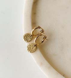 ✤ 14k gold filled ✤ hoops: 13mm ✤ coin charms: 8mm A dainty drop huggie with textured surfaces to radiate light. Tube hoop earrings have secure click style closure.  All components are 14K gold filled so you can wear these daily!  SHIPPING: ✤I offer FREE shipping within Canada but please note that this does NOT include tracking.  If you choose FREE shipping, you risk your package getting lost in transit.  If this happens, I CANNOT issue you a refund or replace your jewelry. ✤Only TRACKED orders Radiate Light, Hoops With Charms, Light Tube, Huggie Earrings Gold, Earrings Gold Hoop, Dangle Earrings Gold, Earrings Hoops, Gold Filled Hoops, Hoop Earrings Gold