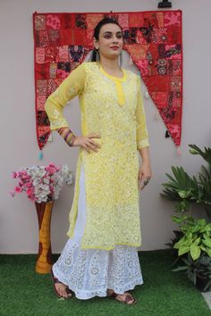 Kurti Details: Fabric: Faux Georgette Color: Yellow Length: 44 inches Size Avl: 38 to 44 Inches bust Sizes Work: Hand Chikankari with Booti Jaal  Chikankari embroidery Embellishment: fully covered by Gota Patti work  Packet Contain: Kurti- Sharara and Matching Inner This  Kurti is made with soft and lightweight Georgette Fabric. Gorgeous Kurta is embellished by gota patti work along with floral intricate Chikarkari embroidery to cover its lustrous look.  Sharara Details: fabric: georgette  Lengt Yellow Chickenkari Kurti, Festive Yellow Anarkali Set With Chikankari Embroidery, Yellow Anarkali Set With Chikankari For Festive Occasions, Unstitched Yellow Kurta With Chikankari Embroidery, Traditional Yellow Georgette Palazzo Set, Yellow Chikankari Embroidered Straight Kurta, Yellow Kurta With Chikankari Embroidery For Diwali, Yellow Straight Kurta Palazzo Set For Festivals, Yellow Chikankari Embroidery Sets For Diwali