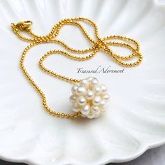 Beautiful and classic Freshwater pearl ball strung through 18" gold plated ball chain  Perfect for a bride, bridesmaid, flower girl, for special occasions or as a gift!!  Diameter of the freshwater pearl ball measures approx. 2cm (3/4 inch)  Comes in a gift box, ready for gift giving.  For more Jewelry designs from Treasured Adornment: http://www.treasuredadornment.etsy.com  Find Treasured Adornment on FACEBOOK, get latest news/designs, FREE GIVEAWAY and get discount Coupon Code!  http://www.facebook.com/TreasuredAdornment  For domestic (U.S.) customers: Ships via USPS First Class mail with delivery confirmation after the payment has been received and the production is complete. You will receive a notice with the tracking number once the item ships.  International customers: Your items wil Bridal Pearl Pendant Necklace Gift, Pearl Pendant Bridal Necklace Gift, Pearl Pendant Bridal Necklace As A Gift, Gold Bridal Necklace With Pearl Drop As Gift, Elegant Ball Chain Necklace As Gift, Bridal Necklace With Pearl Pendant As Gift, Elegant Ball Chain Necklace For Gift, Delicate Chain Pearl Necklace With Round Beads For Gift, Bridal Pearl Pendant Necklace With Round Beads