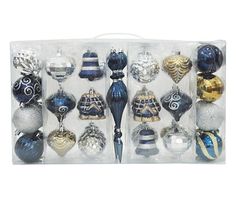 an assortment of glass christmas ornaments in a box