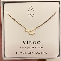 the virgo zodiac necklace is in its box