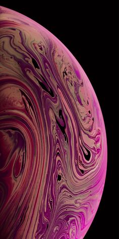 the back side of an iphone with purple and pink swirls on it, against a black background