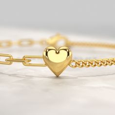 Elevate your style with our exquisite 50-50 Gold Heart Paperclip & Cuban Bracelet. Crafted in gleaming 10K, 14K, or 18K solid gold, this dainty bracelet features alternating heart paperclip and Cuban links, creating a captivating blend of textures. Personalize it with an engraved message or name, transforming this subtly sophisticated piece into a cherished keepsake. Express your love or appreciation with this exquisite gift, perfect for any special occasion. 𝐅𝐞𝐚𝐭𝐮𝐫𝐞𝐬:• 𝐌𝐚𝐝𝐞 𝐭𝐨 𝐎? Heart Paperclip, Cuban Bracelet, Stacked Wedding Rings, Dainty Bracelet, Band Bracelet, Engagement Rings Oval, Dainty Bracelets, Radiant Cut, Gold Heart