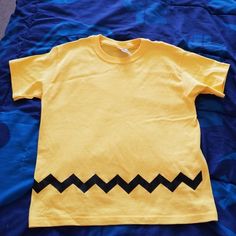 Nwot / Never Used Charlie Brown Themed Boys Tshirt. Had Mede For My Son But Didn't Fit Him. It Says Large But It's More A Medium. Will Fit A Slim Boy. Cute Yellow Tops With Character Print, Cute Yellow Top With Character Print, Cute Yellow Tops For School, Cute Yellow Crew Neck T-shirt, Cute Yellow Cotton T-shirt, Yellow Cotton Tops With Cartoon Print, Unisex Yellow Crew Neck T-shirt, Unisex Yellow Graphic Print Top, Cute Yellow Shirt With Letter Print