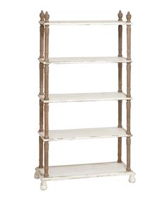 a white shelf with four shelves on each side and three wooden posts at the top