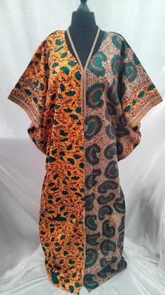 A bold handmade Ankara boubou, also known as a kaftan, long dress or even a boubou gown. Whatever you decide to call it the free flowing floor length dress will definitely have heads turning.  This dress is a one size fits all (from size 10- 20). Please feel free to contact me if you have any questions. Traditional Green Dress With Kimono Sleeves, Traditional Short Sleeve Batik Print Kaftan, Traditional Short Sleeve Kaftan With Batik Print, Traditional Orange Tunic Kaftan, Traditional Green Batik Print Kaftan, Traditional Orange Maxi Kaftan, Traditional Green Kaftan With Batik Print, Traditional Multicolor Tunic With Kimono Sleeves, Traditional Long Multicolor Tunic