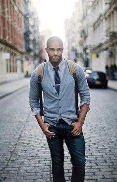 Fall fashion inspiration with a gray cardigan blue gingham shirt with button collars navy tie with silver tie bar denim canvas backpack. Nice business casual fall look. #cardigan #boots #denim #fallfashion #falloutfits #autumnfashion #menswear #mensfashion #menstyle #businesscasual Bald Bearded Men, Navy Cardigan Outfit, Shaved Head With Beard, Cardigan With Tie, Bald Men Style, Cardigan Outfit, Navy Cardigan, Bald Men