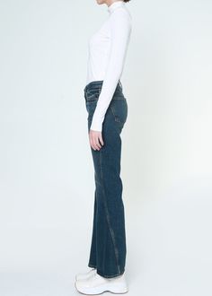 Vintage dark wash jeans with a slimming flare silhouette, featuring soft curves on both the inseam and outseam that gently flare forward. Approx. Front rise: 10.5" Inseam: 31"Approx. Knee: 15.25" Leg opening: 20.25"94% Cotton 4% Polyester 1% Spandex Made in USA Fits true to size. Dark Wash Flares With Five Pockets For Fall, Dark Wash Full Length Fall Flares, Full-length Dark Wash Flares For Fall, Dark Wash Full Length Flares For Fall, Dark Wash Full-length Flares For Fall, Fall Dark Wash Full Length Flares, Spring Dark Wash Flare Jeans, Dark Wash Fitted Full Length Flares, Dark Wash Fitted Full-length Flares