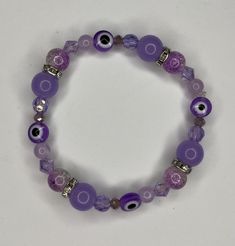 A purple evil eye bracelet Resin Bracelet, Evil Eye Bracelet, Evil Eye, Arm Band, Violet, Favorite Jewelry, Jewelry Bracelets, Bracelet, Beaded Bracelets