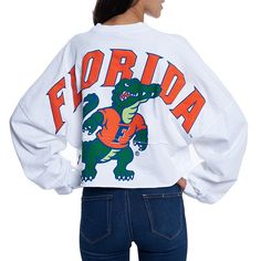 Whether you're a current student, alumni or just a superfan, every member of the Florida Gators franchise needs a solid collection of gear. This season, spruce up your look with this chic Raw Hem Cropped Spirit Jersey T-shirt! The fierce Florida Gators graphics and super-soft blend make this fun top a must-have addition to your closet!Whether you're a current student, alumni or just a superfan, every member of the Florida Gators franchise needs a solid collection of gear. This season, spruce up School Spirit Shirts Designs, School Shirt Designs, School Spirit Wear, School Spirit Shirts, Cheer Shirts, College T Shirts, Jersey Long Sleeve, Spirit Jersey, Spirit Shirts