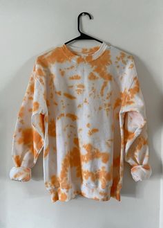 This is a unique orange tie dye crewneck sweatshirt. All clothing is custom made- items are created by hand and will be totally unique! Color distributions, amounts of color, and placement of color will vary slightly from the shown picture. UNISEX SIZING  MATERIAL:  50% cotton, 50% polyester  CARE INSTRUCTIONS:  All sweatshirts have been pre-washed. We recommend washing the clothing inside out in cold water alone or with like colors. You can hang them to dry or tumble dry on a low heat. Tie Dye Crewneck Sweatshirts, Tie Dye Crewneck, Orange Tie Dye, Green Tie Dye, Dye Sweatshirt, Orange Tie, Green Tie, Tie Dye Sweatshirt, Orange And Green