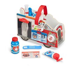 a toy firetruck plays with its contents including toothbrushes and toothpaste