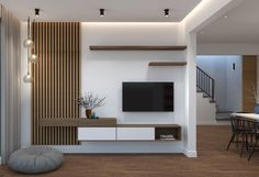 a modern living room with white and wood accents