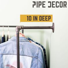 a denim jacket hanging on a clothes rack with the words, pipe decor 10 in deep