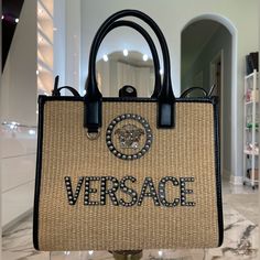 Brand New With Tags And Dust Bag. Beautiful New Collection Style. No Refunds Or Exchanges. Collection Spring - Summer 2024 Description Totes Medusa Hardware Double Top Handle Versace Logo On Front Studded Embellishment Detachable And Adjustable Shoulder Strap Snap Button Closure Made In Italy Measures Height: 25 Cm Width: 14 Cm Length: 30 Cm Smoke-Free Home Pet-Free Home 97-Asls Designer Straw Bag With Double Handle For Daily Use, Designer Double Handle Straw Bag For Daily Use, Designer Straw Tote Bag With Handles, Designer Straw Tote Bag For Daily Use, Designer Bags With Double Handles In Natural Color, Designer Straw Bag For Shopping With Top Carry Handle, Designer Rectangular Straw Bag With Top Carry Handle, Designer Natural Bag With Top Carry Handle, Top Handle Straw Bag With Dust Bag For Shopping