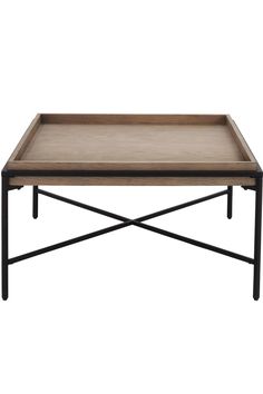 a wooden tray on top of a metal frame coffee table with black legs and an iron base