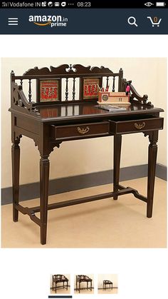 an old desk with two chairs on it and the same table in front of it