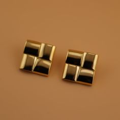 Elevate your look with our Violetta Earrings. These gold statement earrings feature a chunky, woven design that adds a touch of playful sophistication. Dare to take a dip in our new stainless steel, tarnish & fade-free jewel collection. Modern Gold-tone Clip-on Earrings As Gift, Modern Yellow Gold Clip-on Earrings, Modern Gold-tone Metal Clip-on Earrings, Modern Metal Clip-on Earrings Tarnish Resistant, Halo Collection, Gold Statement Earrings, Colored Gems, Woven Design, Gems Jewelry