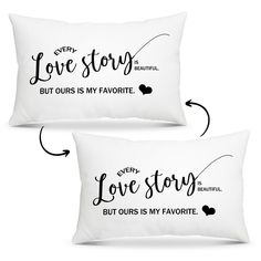 two white pillows with the words love story written in black ink on them, and an arrow