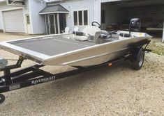 a boat is parked in front of a garage