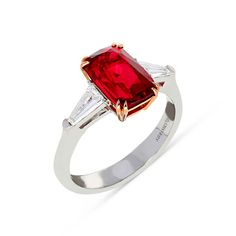 Bring sparkle and sophistication to any look with this classic yet unique Elongated Red Spinel Ring. This majestic three-stone style features a trio of glistening gemstones and diamonds - the largest being an elongated red spinel center stone set in 18K rose gold double cat claw prongs with two kite-shaped diamond side stones flowing seamlessly into an 18K white gold band. Surprise your loved one with this exclusive, hand crafted designer jewelry piece. 
Available in all sizes, se Luxury Marquise Red Ruby Ring, Luxury Red Marquise Ruby Ring, Red Diamond Ring With Baguette Cut, Luxury Three Stone Ruby Ring, Luxury Red Ruby Ring With Gemstone Accents, Formal Red Ruby Ring With Three Stones, Formal Ruby Three Stone Ring, Formal Red Three Stone Ruby Ring, Luxury Ruby Three Stone Rings