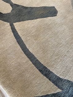 a rug with scissors on top of it