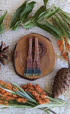 Beautiful tassel earrings in amber orange, copper, green, and gold miyuki and fire polished beads. The amber orange adds the perfect amount of shine for bringing in the new season.  Made with high quality Japanese seed beads. Comes with a gift box 🎁💞 Handmade Bohemian Long Drop Earrings, Multicolor Tassel Drop Earrings, Multicolor Handwoven Tassel Earrings Gift, Handmade Multicolor Tassel Drop Earrings, Handmade Bohemian Long Drop Chandelier Earrings, Handwoven Tassel Drop Earrings As A Gift, Handwoven Multicolor Tassel Earrings Gift, Handmade Adjustable Bohemian Tassel Earrings, Handwoven Tassel Drop Earrings For Gift