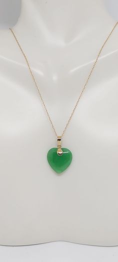 Heart Green Jade 14k Solid Yellow Gold Charm / Pendant / Necklace 18 Inches 14k ROPE Yellow Gold Chain. JADE HEART LOVER. Green Jade is the most admired gemstone by the Chinese. They consider it a symbol of the five virtues, which are modesty, courage, justice, wisdom, and compassion. These virtues are often carved into Green Jade stones. Green Jade birthstones are quite tough and are carved into unique and exquisite designs. Product Info: - Heart Stone: Green Jade. - Stone Color: Green. - Heart Green Jade Heart Necklace, Ruby Jade Gold Necklace, Jade Pendant Necklace Simple, Green 14k Gold Heart Jewelry, Green Heart-shaped 14k Gold Jewelry, Green 14k Gold Heart Pendant Necklace, Heart Stone, Green Heart, Jade Earrings