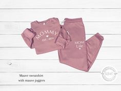 Mom sweatpants set for women is stylish and comfortable for the mom on the go. Select from MAMA, MOMMY, or MOMMA with EST custom year. This unisex fit Bella Canvas jogger and sweatshirt set is the softest sweats set you'll love to wear to lounge, sleep, or as casual wear. Makes a great gift for expecting mom, mom, step-mom, family, or friend. Available in XSmall to 2X Large unisex fit. ♥EACH PIECE SOLD SEPARATELY  TO SEE MY STOREFRONT FOR MORE ITEMS, GO HERE 👉🏼 https://www.etsy.com/shop/GBVC ? Relaxed Fit Sweatshirt For Mother's Day Loungewear, Mother's Day Relaxed Fit Sweatshirt For Loungewear, Casual Sweatshirt For Mother's Day Loungewear, Sweats Set, Mom On The Go, Lounge Wear Set, Hospital Outfit, Step Mom, Sweatsuit Set