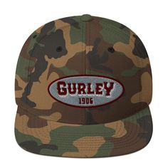 Introducing the Gurley 1906 Embroidered Snapback Hat, designed for a structured, classic fit with a flat brim and full buckram for added sturdiness. With an adjustable snap closure, this hat ensures comfort for wearers of all sizes. Crafted from a blend of 80% acrylic and 20% wool, and 60% cotton and 40% polyester for the Green Camo option, this 6-panel, high-profile hat features 6 embroidered eyelets and a plastic snap closure. The green under visor adds a touch of style, while proudly supporting a Black Owned & Operated Business. • 80% acrylic, 20% wool• Green Camo is 60% cotton, 40% polyester• Structured, 6-panel, high-profile• 6 embroidered eyelets• Plastic snap closure• Green under visor• Black Owned & Operated Business Black Excellence, Green Camo, Snapback Hat, Hat Designs, Snapback Hats, Snap Closure, Camo, Wool, Hats