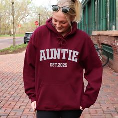 Custom Auntie Hoodie, Personalised Aunt Hoodie, Baby Pregnancy Announcement Hoodie, Auntie Announcement Hoodie, Gift Aunt Birthday Hoodie Welcome to TrendswayStore! You are where you can find your style and comfort. We are here to introduce you to the latest trends and quality products. Start exploring now We wish you pleasant shopping! PRODUCT DETAILS -Fit: Relaxed fit, suitable for both men and women (unisex). -Material: Made from 50% cotton and 50% polyester. -Ribbing: 1 x 1 rib with spandex, likely on the cuffs and waistband for better stretch and recovery.- -Hood: Double-lined hood for extra warmth and durability. -Drawcord: Color-matched drawcord for adjusting the hood (note: for youth hoodies, the drawcord is typically omitted for safety reasons). -Pocket: Pouch pocket on the front Long Sleeve Hoodie With Letter Print For Birthday, Birthday Long Sleeve Hoodie With Letter Print, Birthday Letter Print Long Sleeve Hoodie, Hooded Letter Print Sweatshirt For Birthday, Hooded Sweatshirt With Letter Print For Birthday, Winter Birthday Hoodie With Letter Print, Winter Birthday Hooded Hoodie, Auntie Announcement, Baby Pregnancy Announcement