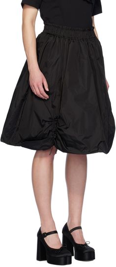 Insulated nylon taffeta skirt. Ruching and adjustable self-tie drawstring throughout. · Elasticized waistband · Two-pocket styling · Fully lined Supplier color: Black Spring Nylon Gathered Skirt Bottoms, Chic Ruched Nylon Bottoms, Summer Gathered Nylon Skirt, Spring Full Nylon Skirt, Nylon Full Skirt For Spring, Chic Nylon Gathered Skirt Bottoms, Chic Nylon Bottoms With Gathered Skirt, Black Nylon Skirt, Chic Nylon Pleated Skirt