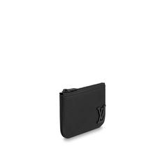 Compact and practical, the key pouch in elegant black aerogram leather is ideal for men with classic tastes. The “lv” initials in matching black metal add a subtle signature touch. Perfect for carrying coins and cards as well as keys, it fits snugly in a pocket, or can be clipped to a larger bag with its handy chain and hook. Louis Vuitton Key Pouch, Key Pouch, Louis Vuitton Official, Black Hardware, Large Bag, Chain Ring, Men's Collection, Luxury Handbags, Key Rings