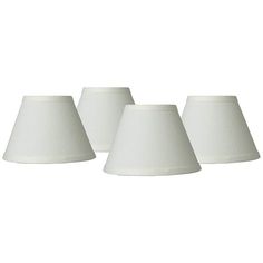 three white lampshades on a white background