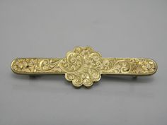 Gorgeous 9ct Yellow Gold 375 Floral Brooch Pin.  -A typically vintage looking brooch, very good vintage condition.   Crafted from solid 9ct yellow gold 375. -A beautiful vintage brooch, delicately carved with floral patterns across the whole face of the brooch,   securely fastens with a metal pin & C clasp. -Brooch length approx 44.5mm -Brooch height approx 13.5mm -Weighs just over 5grams. -Stunning design really eye catching.  Not hallmarked but has been checked & tested.  Very good vintage condition  Even though my jewellery is vintage I polish it to be worn straight away. -POSTAGE IS FREE within UK.  This includes all packaging and postage costs including a nice gift bag.  Overseas postage I now have to charge for due to the problems Royal Mail have faced. Antique Yellow Gold Brooches With Intricate Design, Antique Hallmarked Yellow Gold Brooch, Antique Hallmarked Yellow Gold Brooches, Antique Yellow Gold Hallmarked Brooches, Gold Victorian Brooch With Intricate Design, Antique Yellow Gold Collectible Brooches, Antique Yellow Gold Brooches Collectible, Victorian Gold Brooch With Intricate Design, Vintage Yellow Gold Filigree Brooches