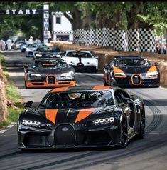 two bugatti cars driving on a race track