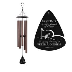 a wind chime with an image of a golf player on the front and back