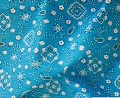 a blue and white fabric with flowers on it