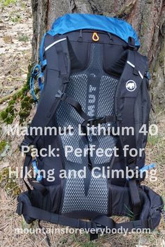 a backpack sitting in the grass next to a tree with text that reads mammoth lithium 40 pack perfect for hiking and climbing